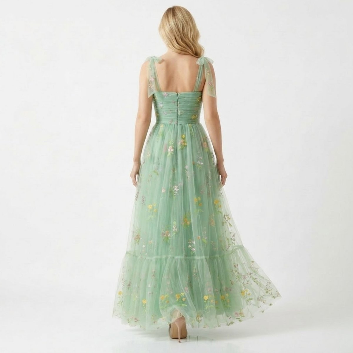 Back view of Kouvr  green embroidered maxi dress showing invisible zipper and tulle tie straps