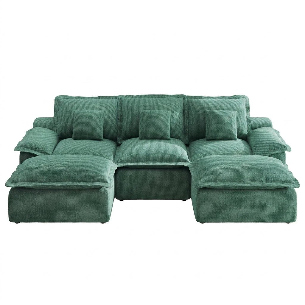 green-modular-sectional-open-concept-living.jpg	Open-concept living space featuring a green modular sectional sofa, jute rug, and wooden dining table.
