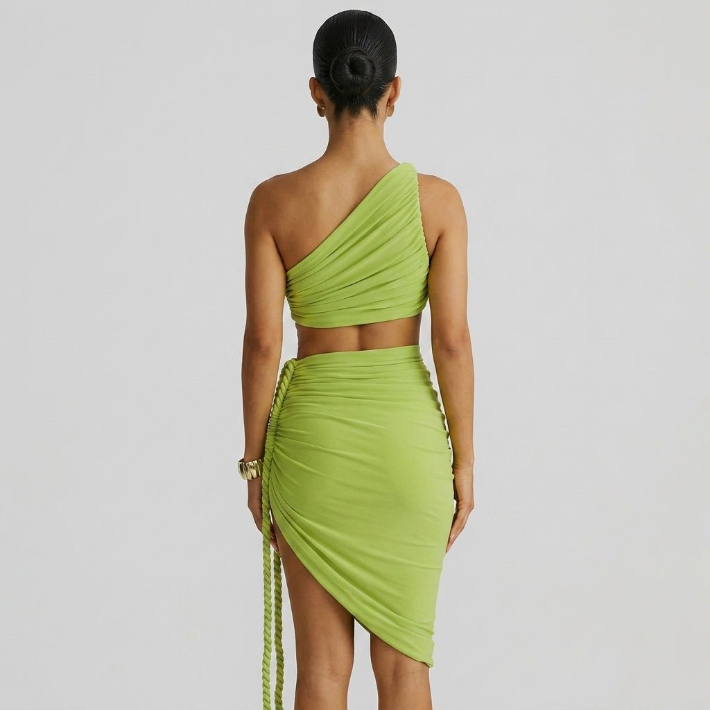 Back view of woman in Kouvr green bodycon dress showing asymmetric ruching and braided rope detailing