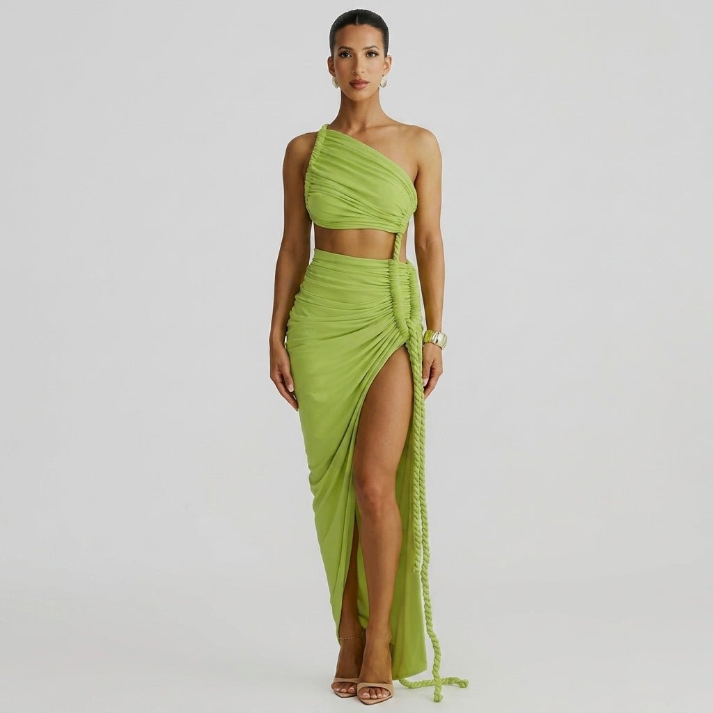 Woman wearing Kouvr green one shoulder cutout ruched maxi dress with high thigh slit facing forward