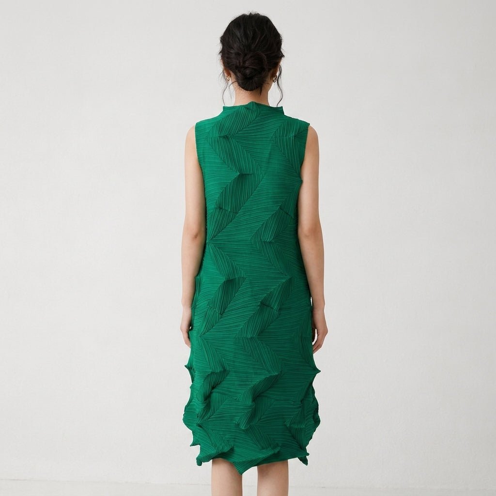 Back view of a woman modeling an emerald green high neck 3D pleated shift dress, highlighting the geometric fabric texture.