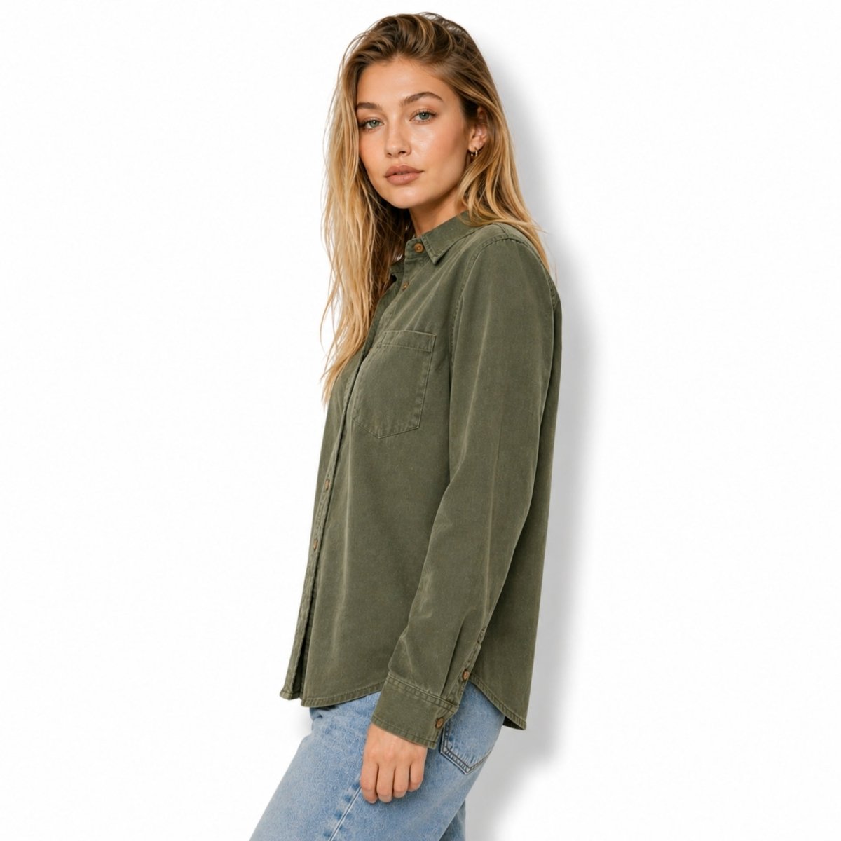 Side profile of a woman modeling a relaxed fit green utility blouse