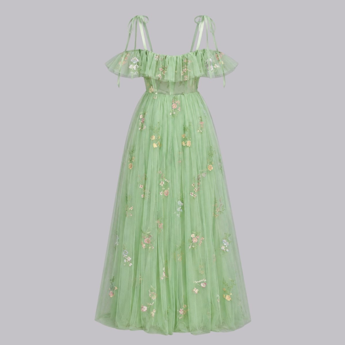 Isolated product view of full length green floral embroidered tulle corset gown against a light grey background.