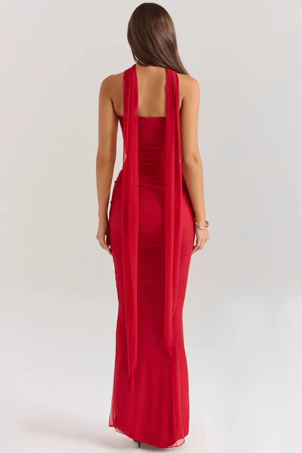 Back view of the Hailey red formal gown, highlighting the long, flowing mesh scarves that extend from the choker neck.