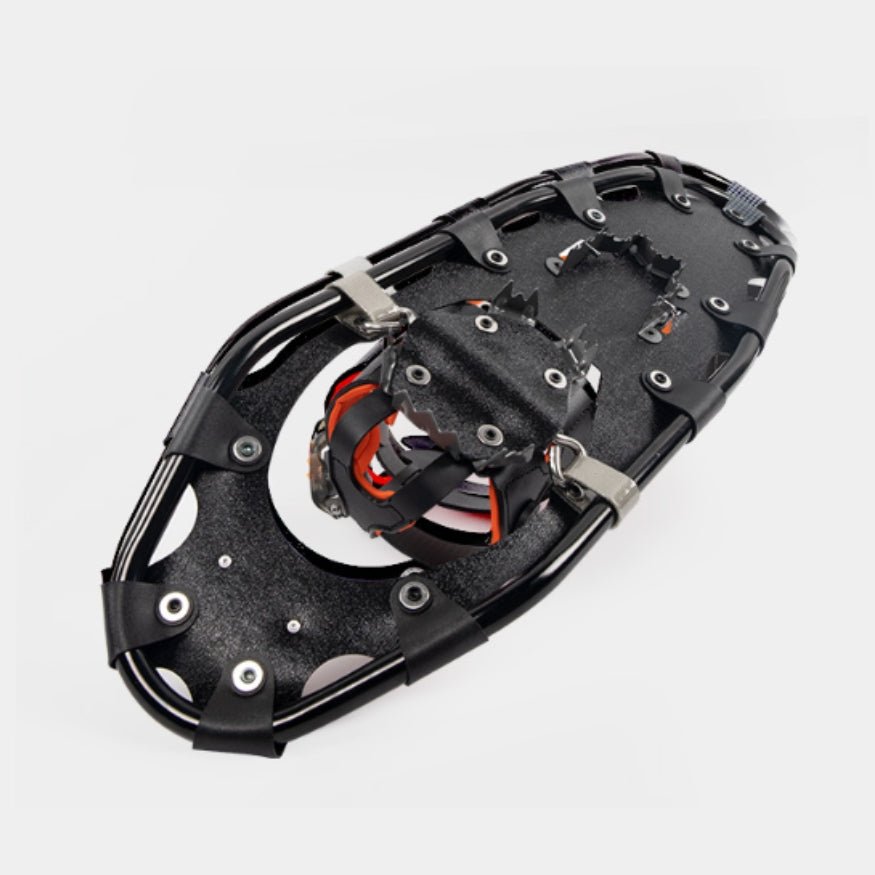 Underside view of a G2 Gether snowshoe showcasing aggressive steel crampons for ice and hard-packed snow.