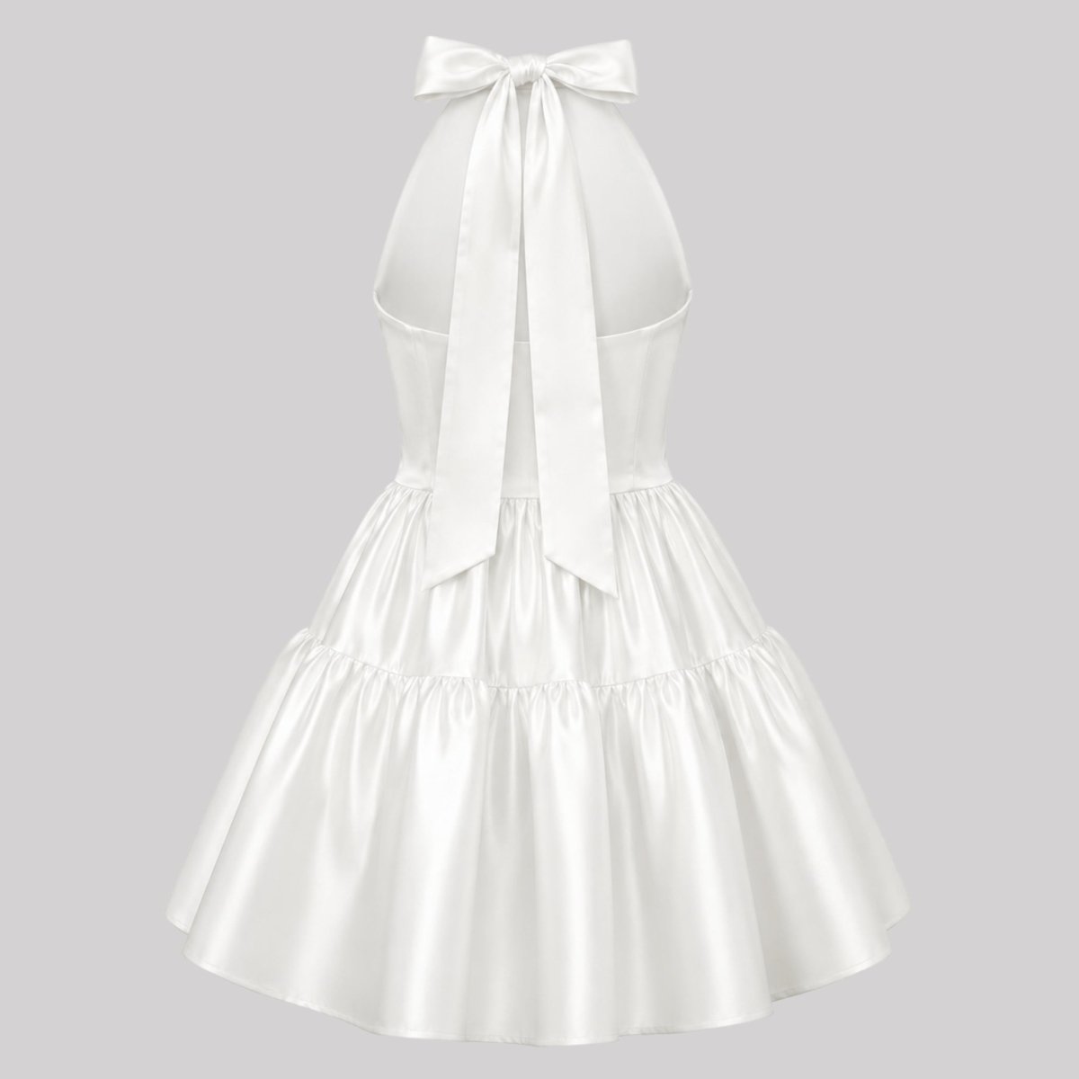 Ghost mannequin back view of a ivory party dress showing an oversized neck bow tie and center back zipper.