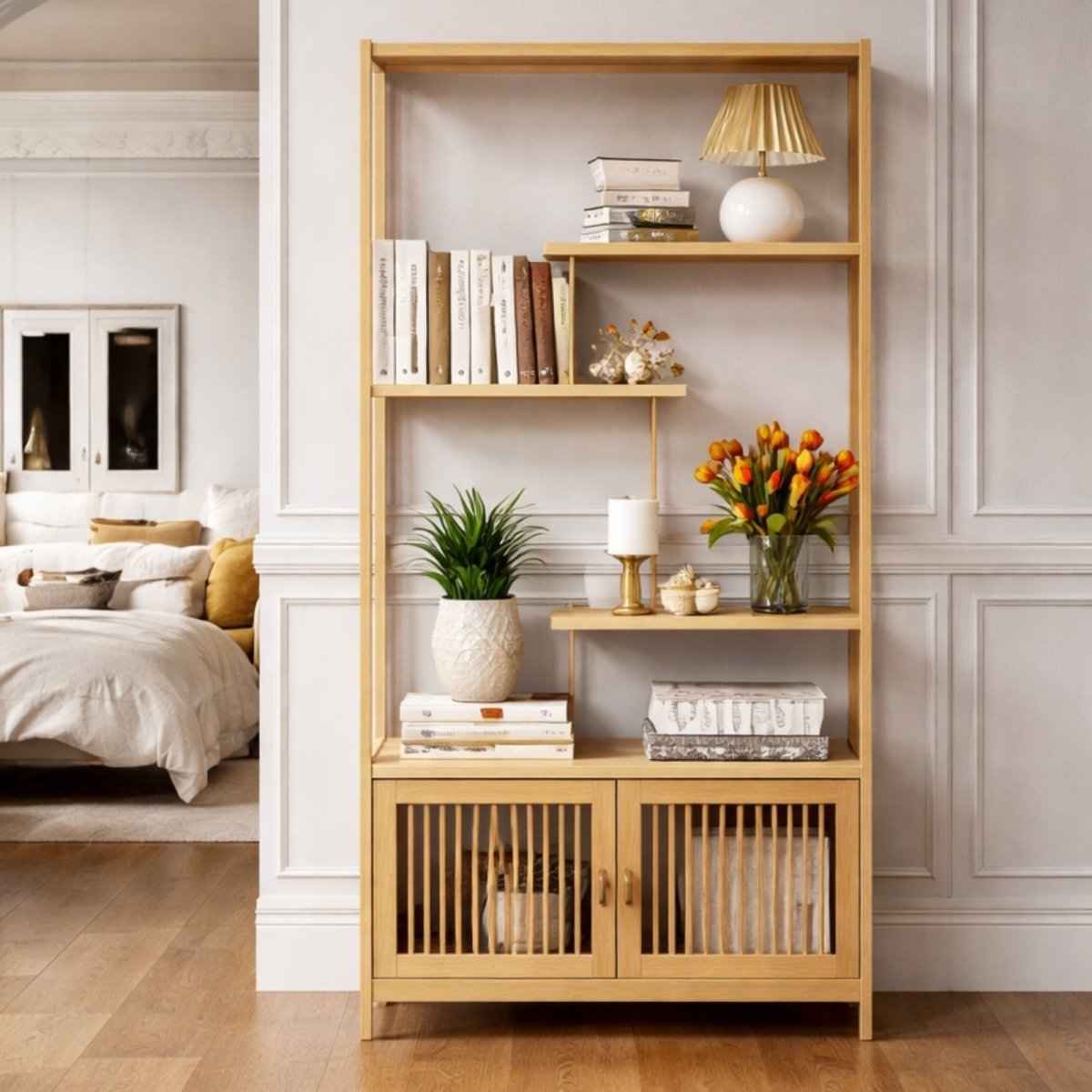 Tall natural wood bookshelf with vertical slat cabinet doors styled with books and plants in a bright luxury living room.