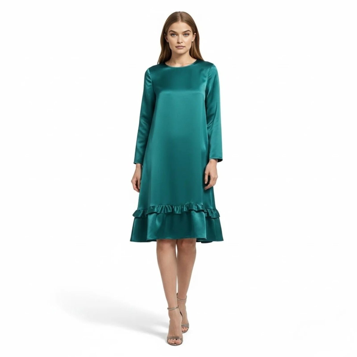 Model wearing the Kouvr Adalee long sleeve teal satin dress with a ruffle hem, facing forward.