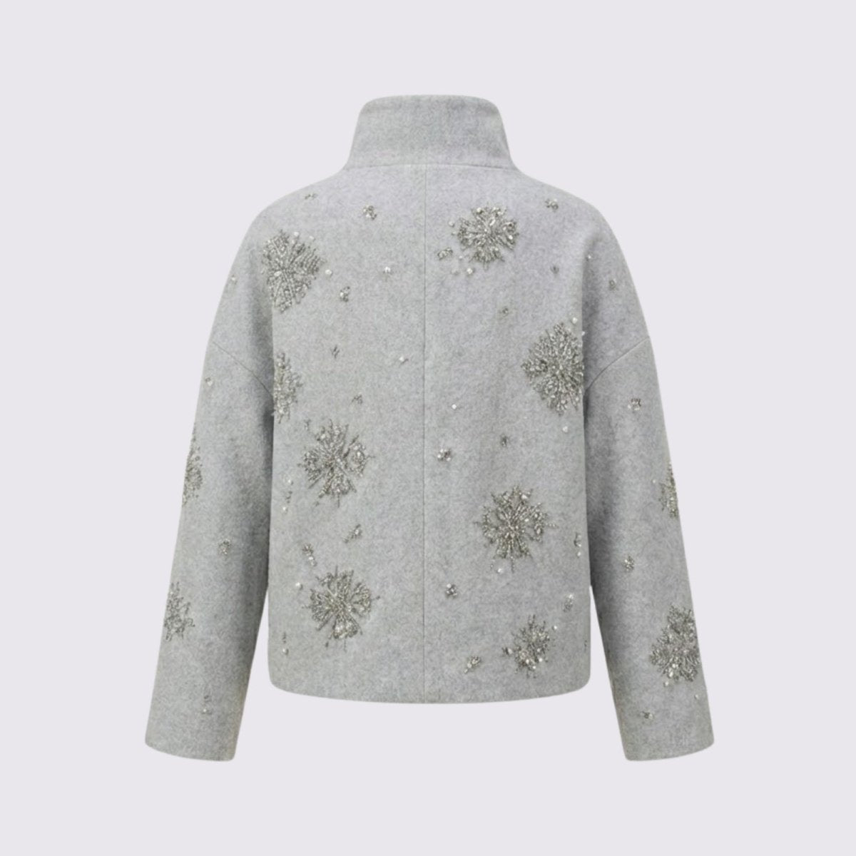 Back product shot of the Kouvr Alisa wool-blend jacket in light grey, laid flat to show the placement of the hand-beaded crystal snowflake patterns.