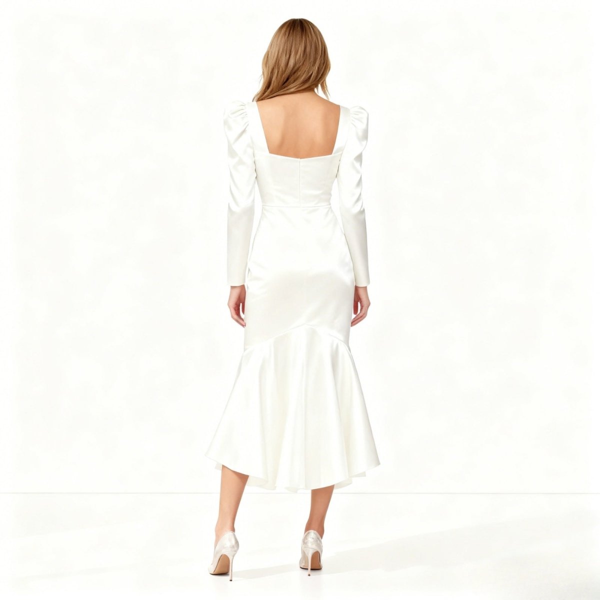 Alyssa long sleeve dress, highlighting the sculptural fit, ruched hip detail, and elegant silhouette.