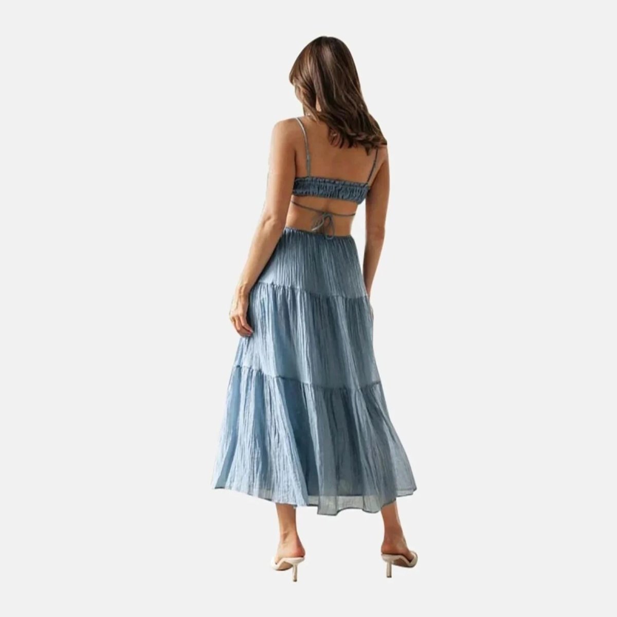 Back view of the Amelia blue maxi dress, showing the smocked back and tie detail.