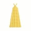 Yellow Kouvr dress with thin straps on a plain background
