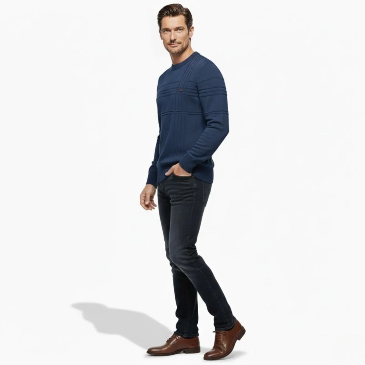 Side profile of a man walking in the Kouvr Ander slim fit textured sweater in blue, showcasing the fit and sleeve detail.
