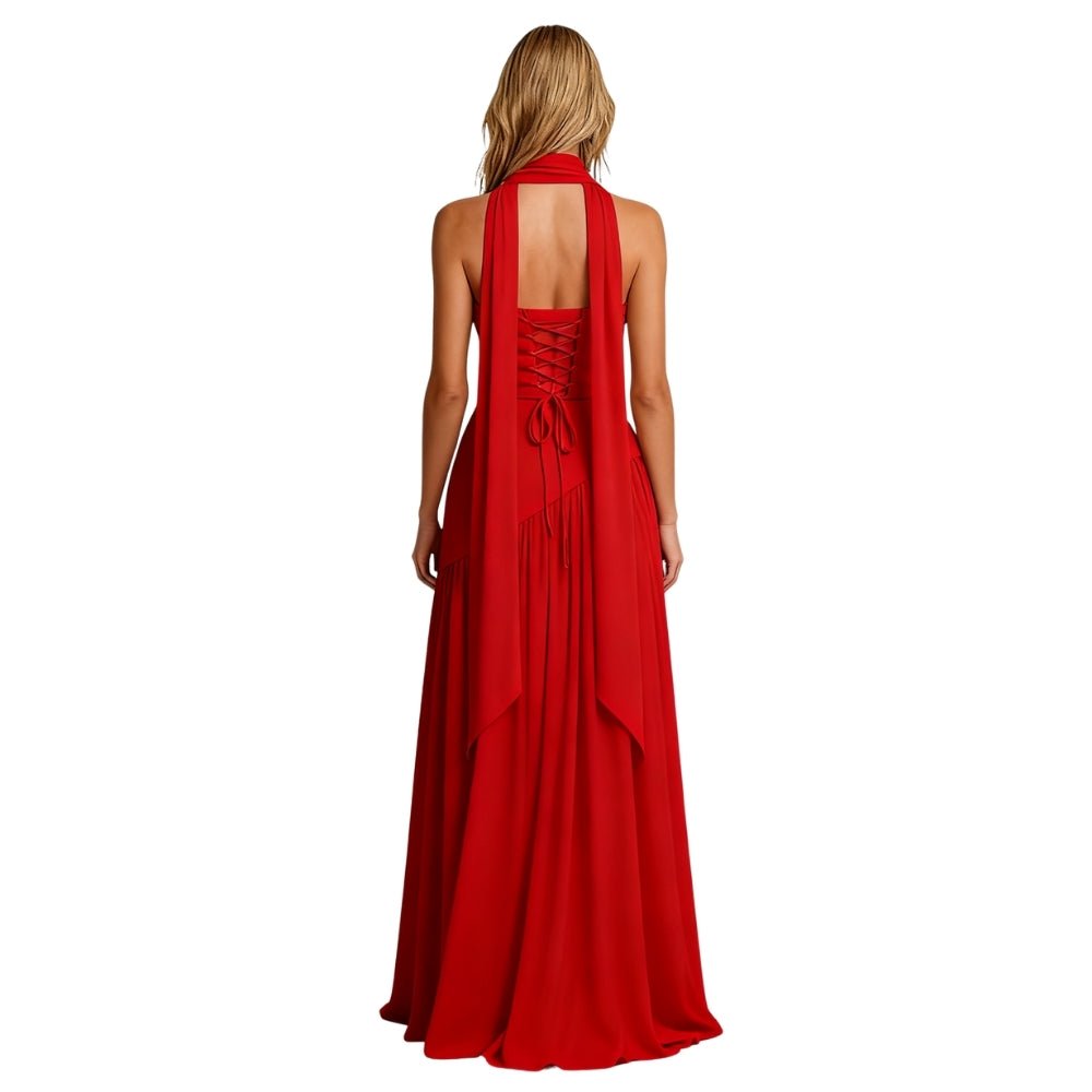 Woman wearing a red Kouvr dress with long sleeves and open back on a white background