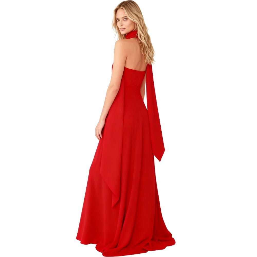 Woman wearing a red Kouvr evening gown with a white background