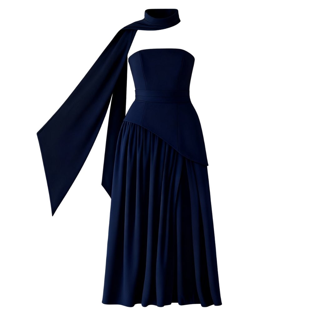 Navy Kouvr strapless gown with a long train on a white background