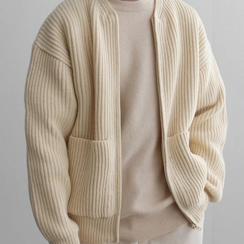 Minimalist zip up sweater, collarless knit outerwear, luxury oversized cardigan, quiet luxury jacket, off-white structured knit, contemporary men's knitwear