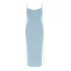 Model wearing Kouvr Ari light blue backless satin midi dress with tie shoulders against a white background