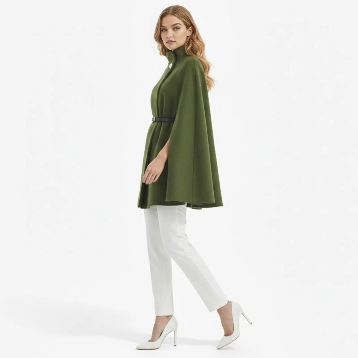 Side profile of a model wearing the Kouvr army green A-line cape coat, showcasing its drape and structure.