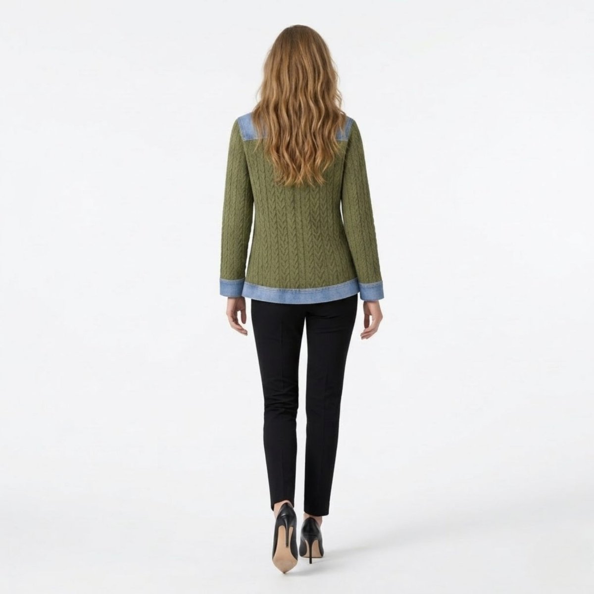 Back view of female model wearing the Kouvr army green cable knit cardigan highlighting the structured denim back yoke and bottom hem details.
