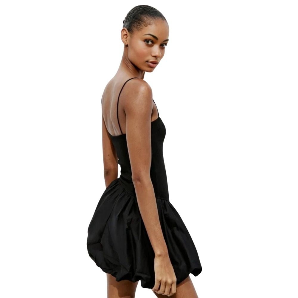 Model wearing the Kouvr Aubrey black mini dress with a voluminous bubble skirt and square neckline