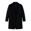 Man wearing a black Kouvr coat on a white background