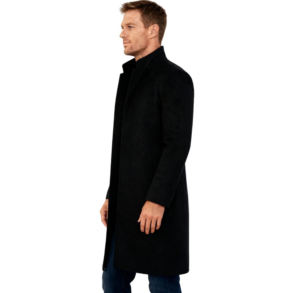 Man wearing a black Kouvr coat on a white background
