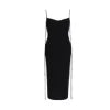 Woman wearing Kouvr black backless silk slip dress with pearl necklace" and "Detailed view of the low open back and adjustable straps on the Kouvr evening dress.