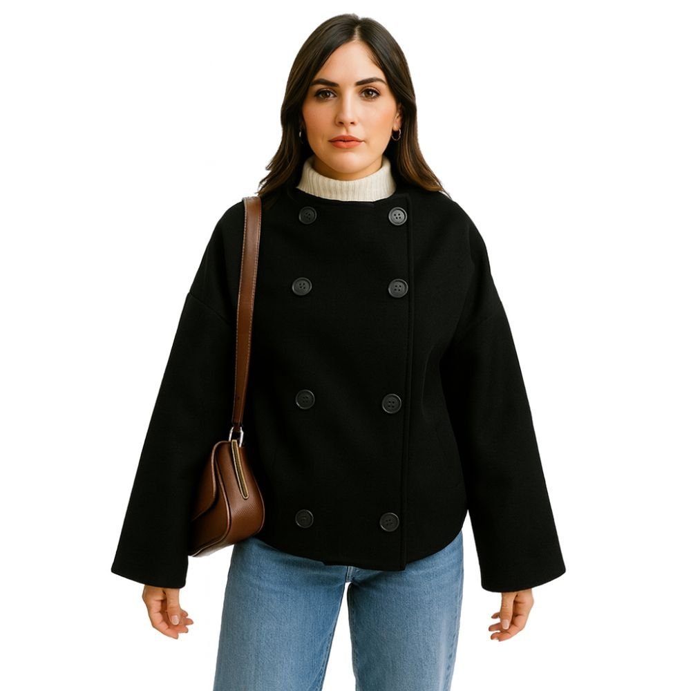 Model wearing the Kouvr black cropped wool pea coat, showing the double-breasted front and modern boxy silhouette against a white background.