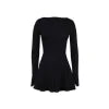 Model from behind wearing the Kouvr Fashion black long sleeve mini dress, showing the button details on the split cuffs