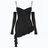 Model from behind wearing Kouvr's black glitter mini dress with asymmetrical ruffle train and sheer gloves