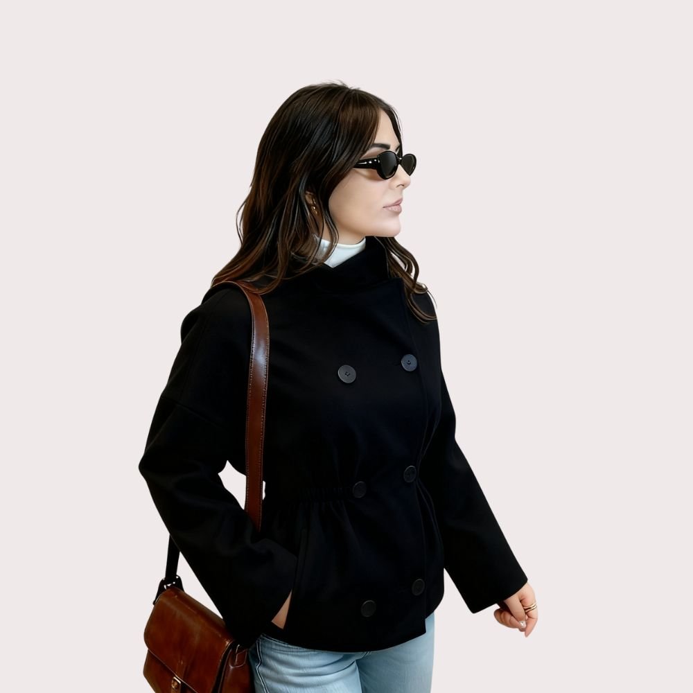 Model from the back wearing the Kouvr Black Niana Cropped Peacoat showing the boxy fit and back button details
