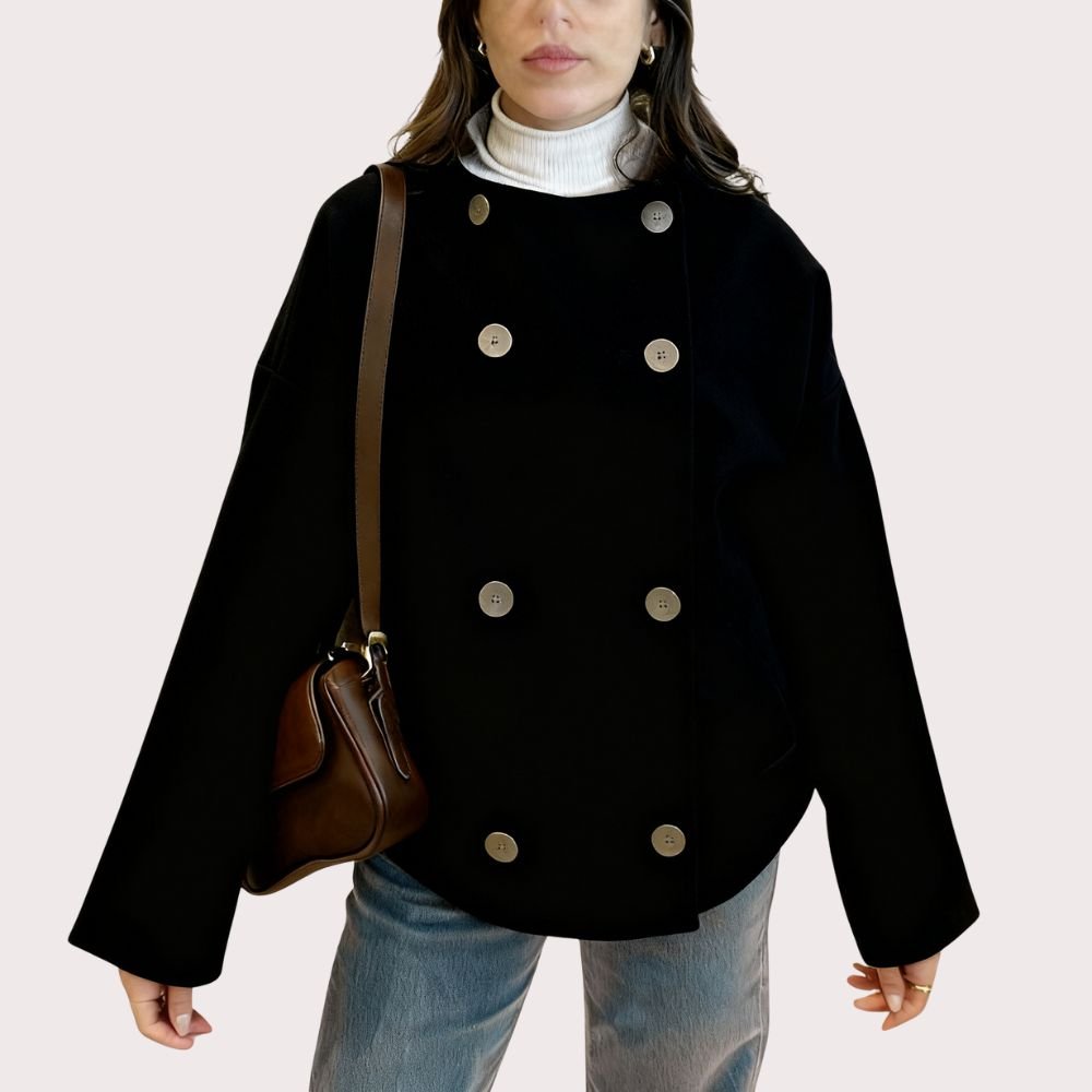 Model from the back wearing the Kouvr Black Niana Cropped Peacoat showing the boxy fit and back button details