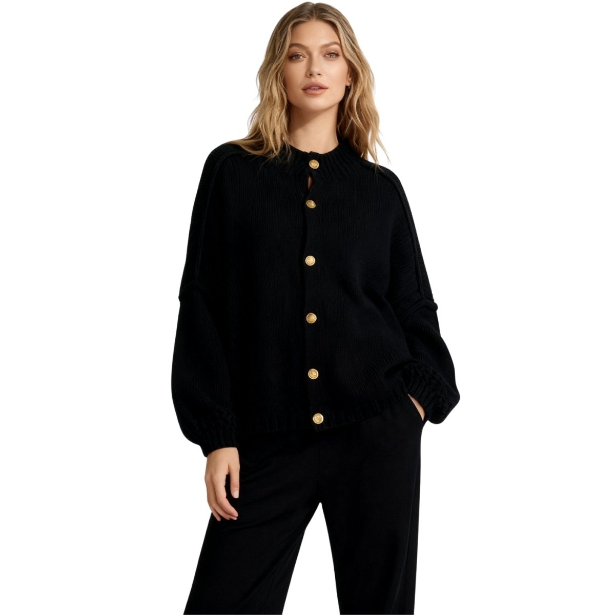 Woman wearing the Kouvr black oversized chunky knit cardigan with large gold buttons