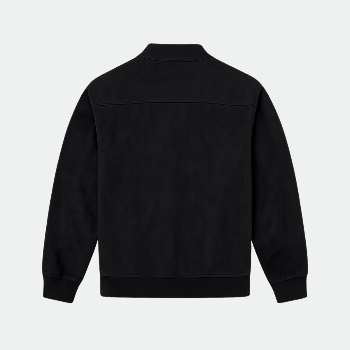 Back product shot of the Kouvr minimalist black suede bomber jacket, showing the clean lines and construction. 