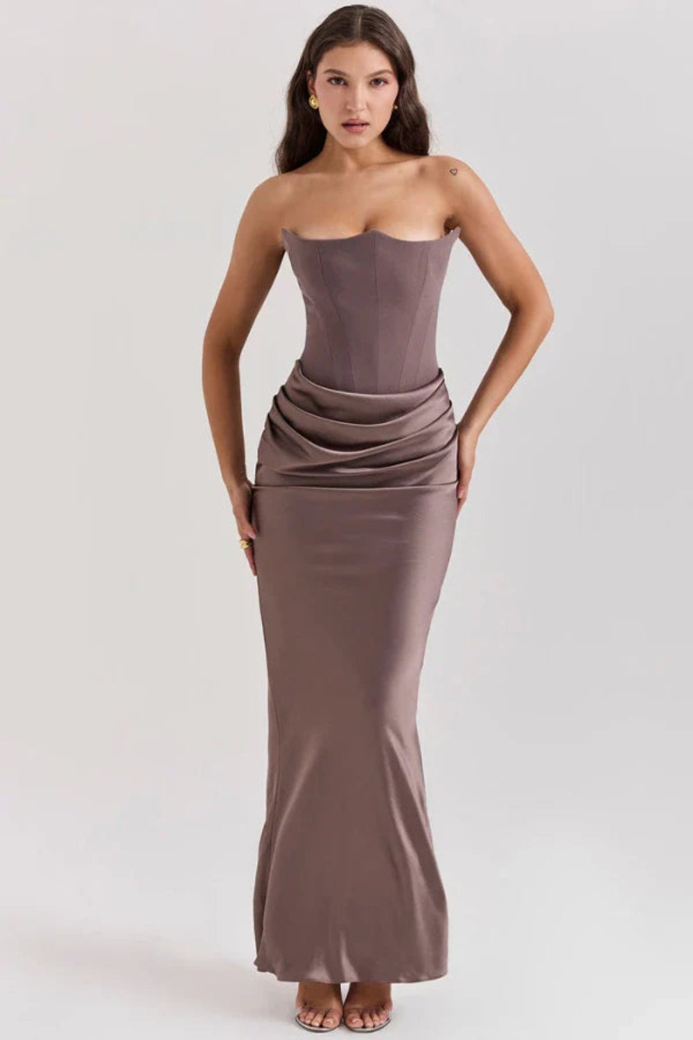 sculptural," "figure-flattering," "boned bodice," "ruched hip detail," and "black-tie attire