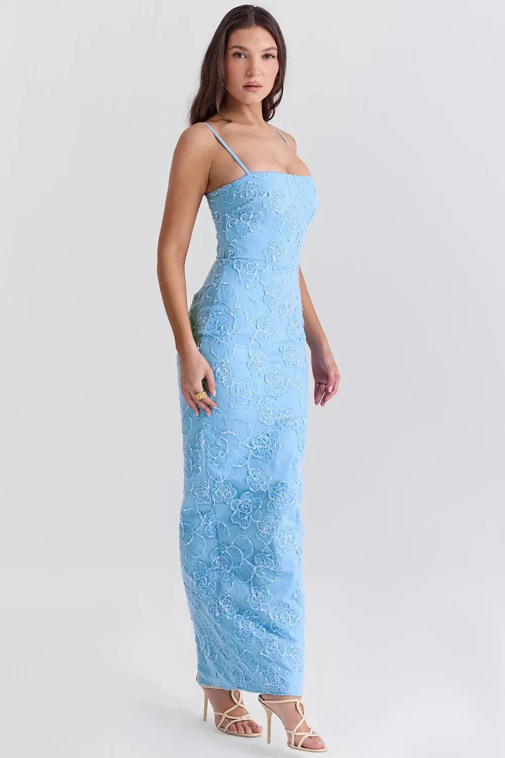 Model wearing Kouvr light blue floor-length gown with 3D floral embroidery