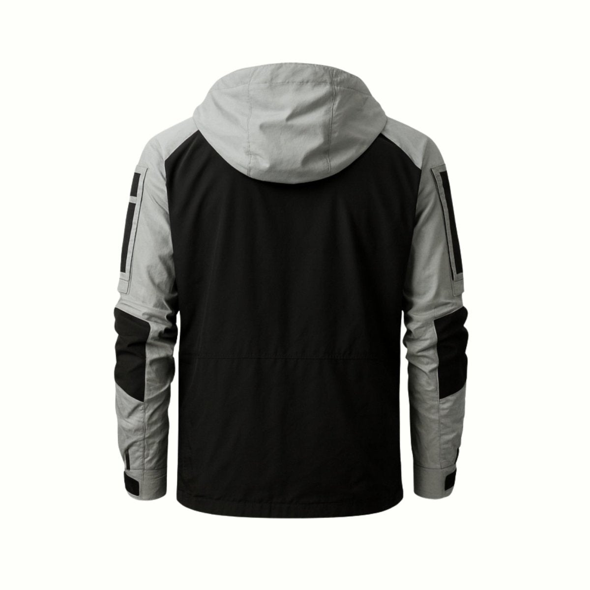 Flat lay product photo showing the back of the Kouvr Clint Tactical Anorak Jacket, detailing the construction of the hood and paneled design.