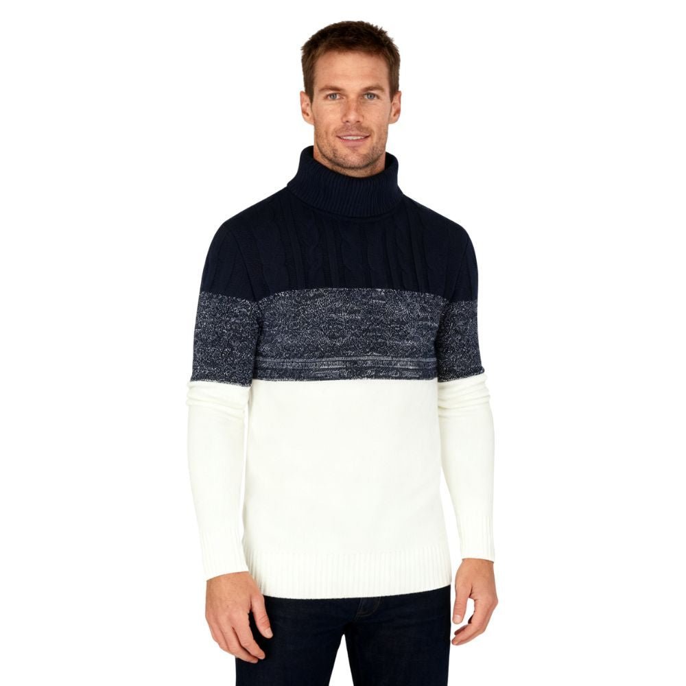 Man wearing a black and white kouvr sweater on a white background