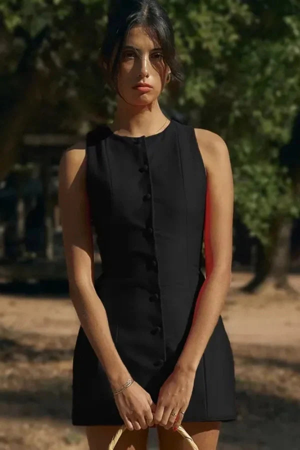 Model wearing the Kouvr Fashion Cosette black sleeveless mini dress