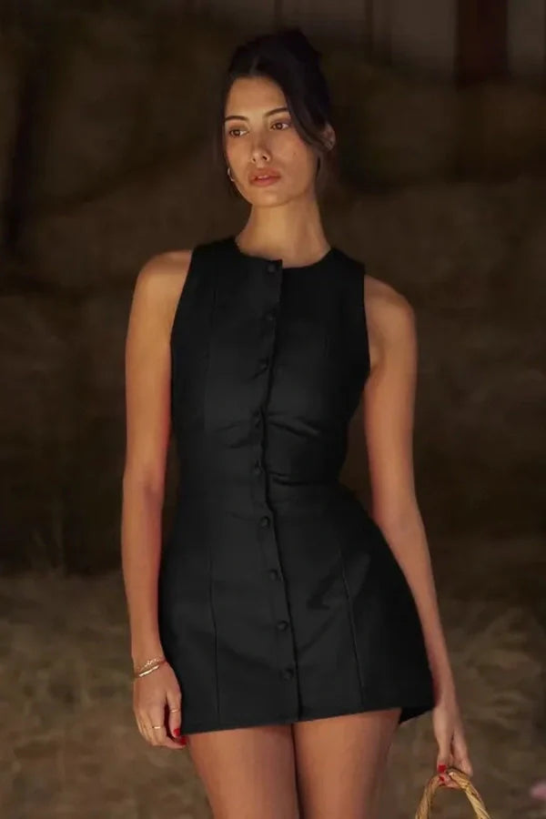Model wearing the Kouvr Fashion Cosette black sleeveless mini dress