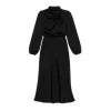 Model viewed from the front wearing the Kouvr black satin long sleeve cowl neck midi dress