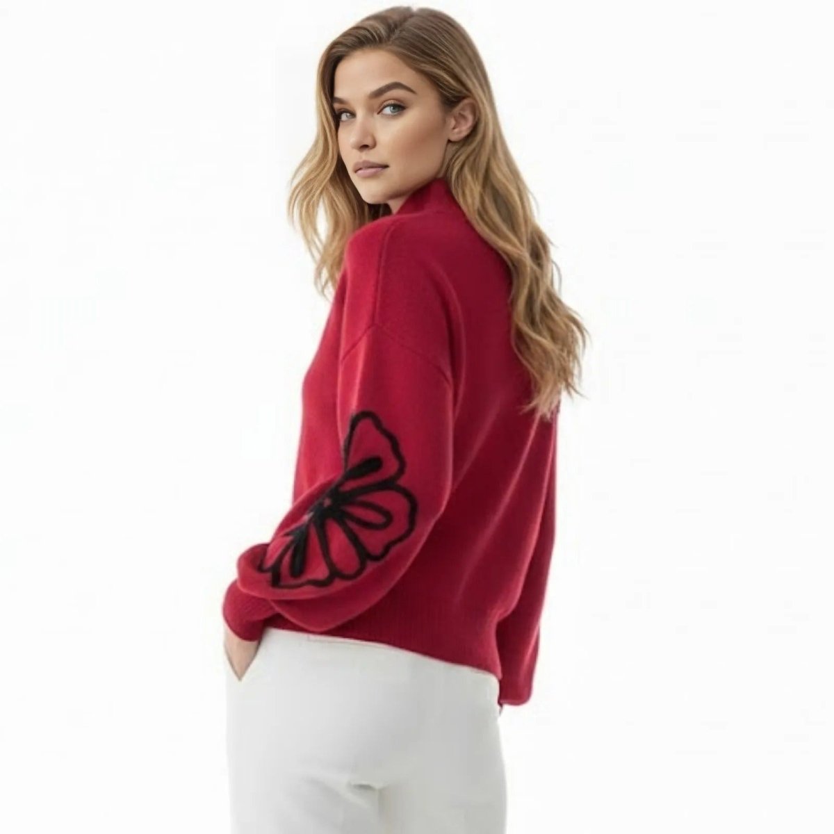 Back view of the Kouvr Cynthia red sweater on a model, highlighting the relaxed fit and elegant silhouette.