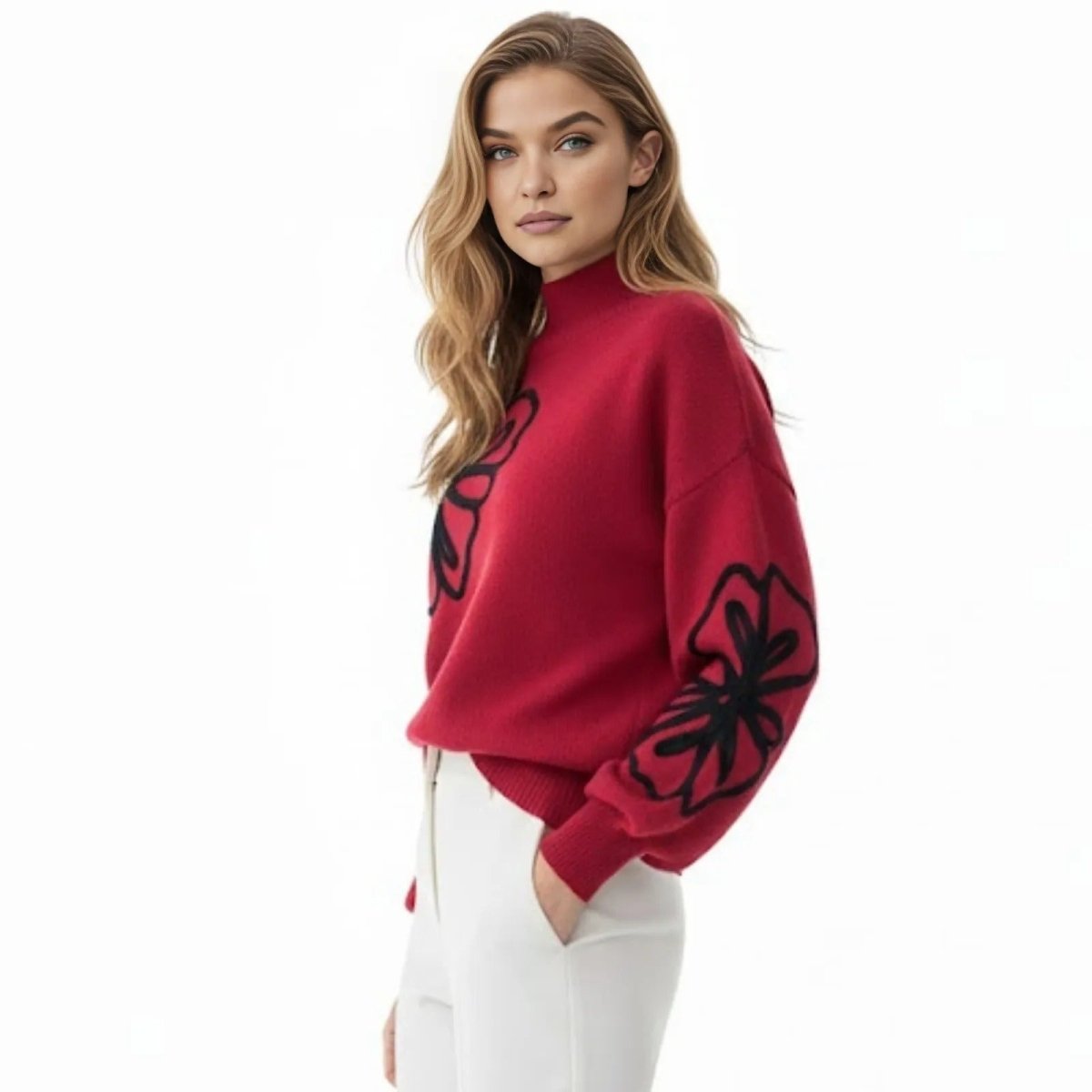 Side profile of a model in a red cashmere blend sweater showing the detailed black floral embroidery on the balloon sleeve.