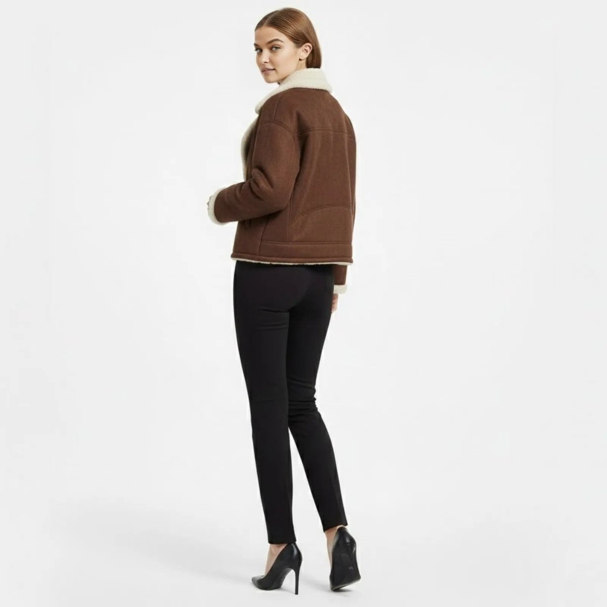 Back view of the Kouvr women's dark brown aviator jacket highlighting the panelled seam details.