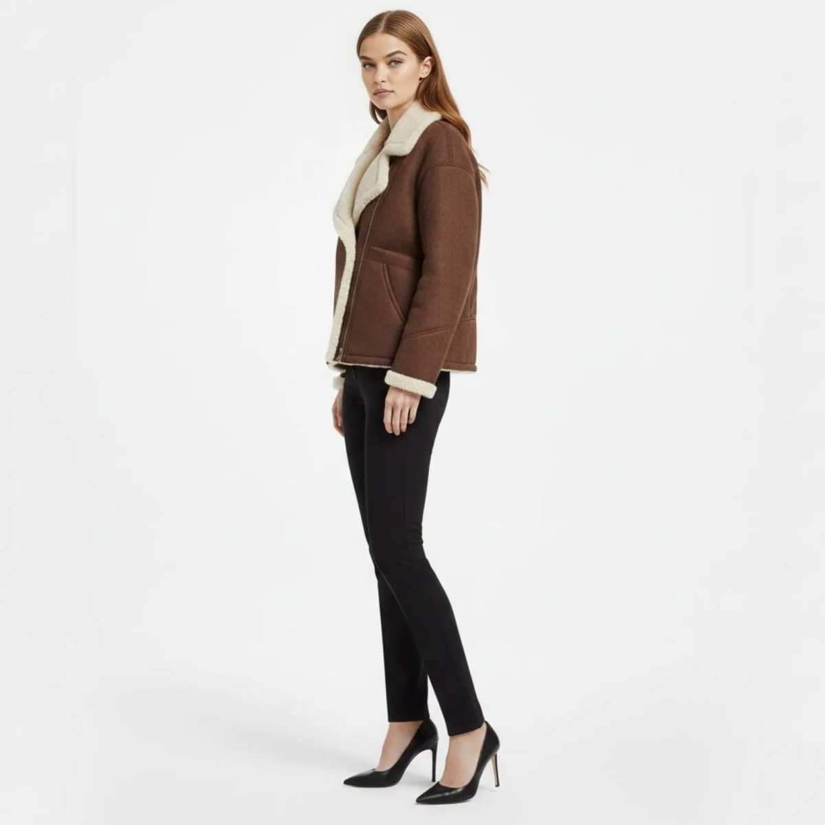 Side profile of a model in the Kouvr dark brown shearling-lined moto jacket showing its relaxed fit.