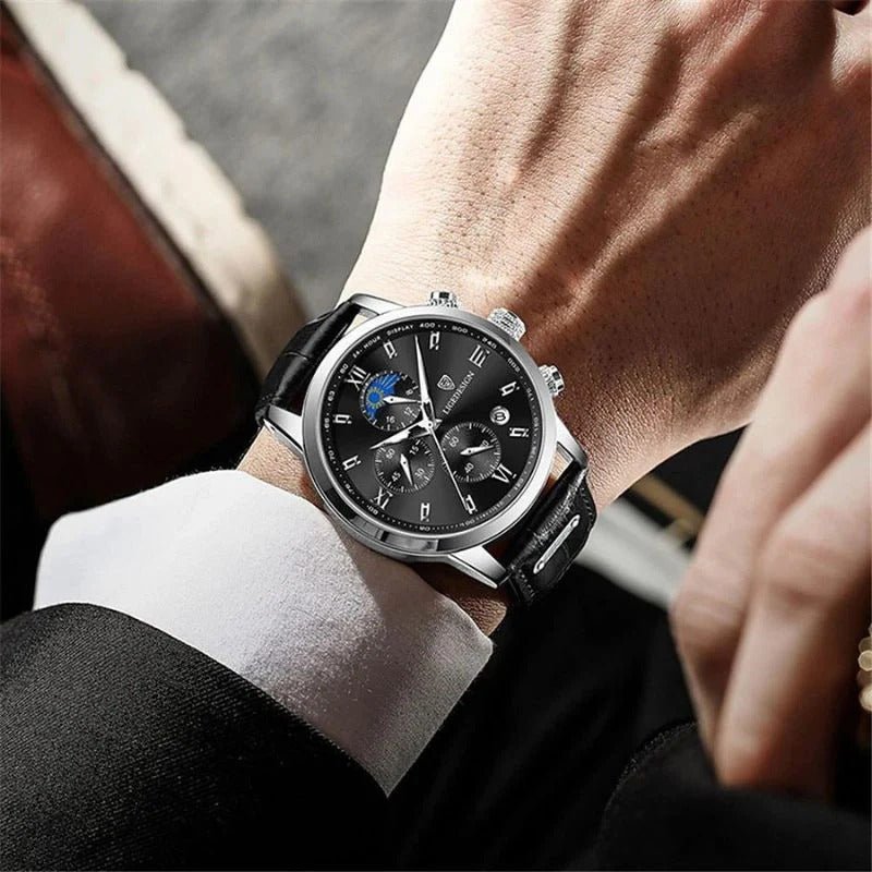 Studio shot of the Kouvr Dexter Chronograph watch, showing the detailed black dial, moon phase indicator, and silver stainless steel case.