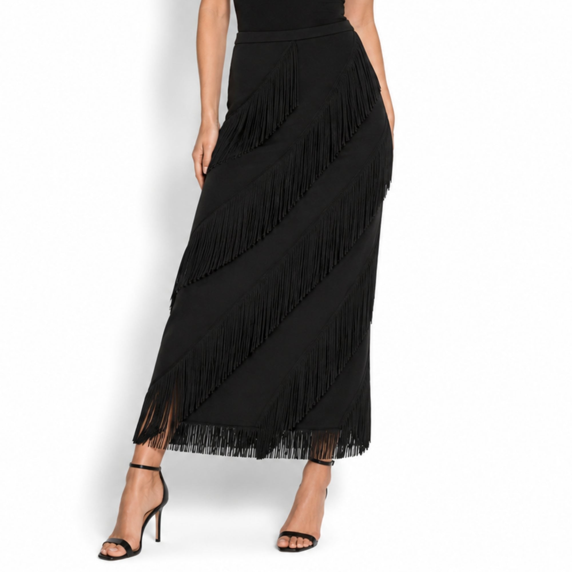 Close up detail of premium diagonal cascading fringe and soft fabric texture on black luxury maxi skirt