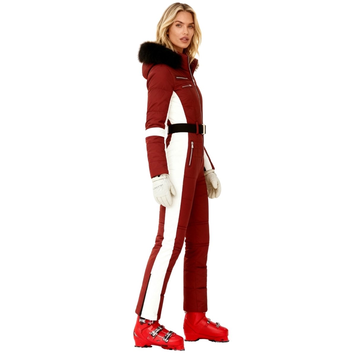 Woman wearing a Kouvr red and white ski suit with black fur trim on a white background