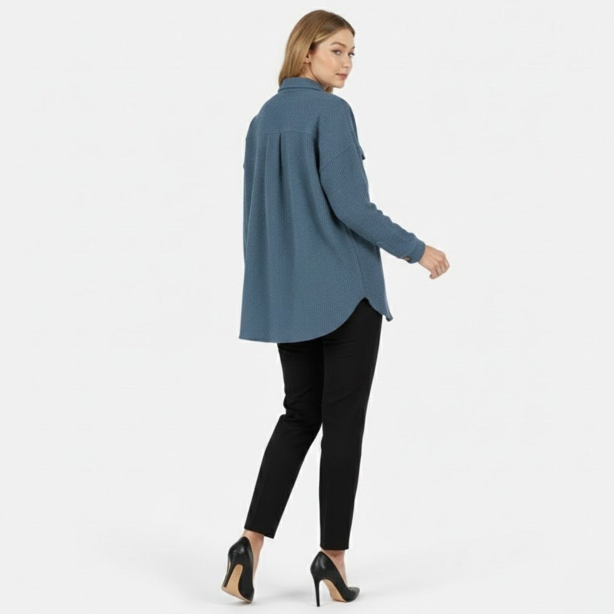 Back view of the Kouvr waffle knit shirt jacket highlighting the center box pleat and oversized silhouette.